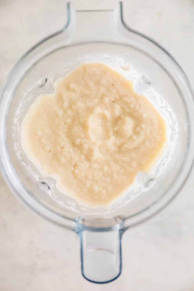peach smoothie mixed in a blender.