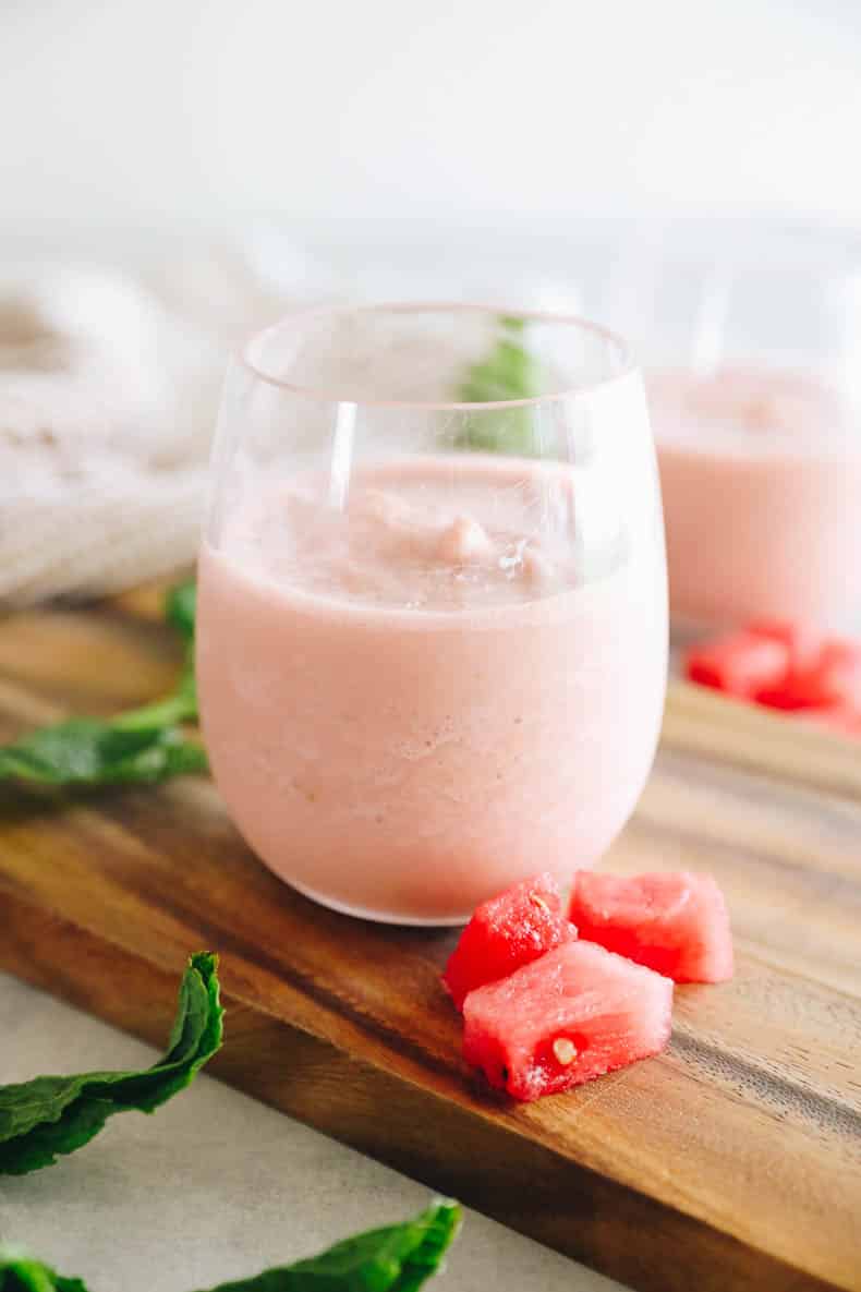 watermelon smoothie in a clear wine glass