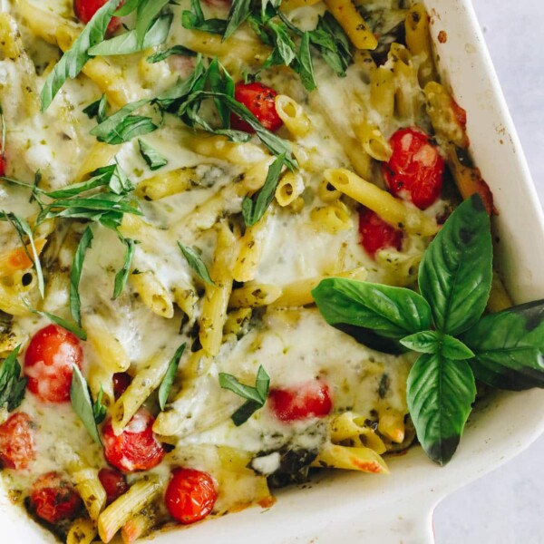 overhead of pesto pasta in a baking dish.