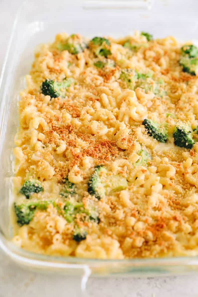 Baked healthy mac and cheese in a clear baking dish.