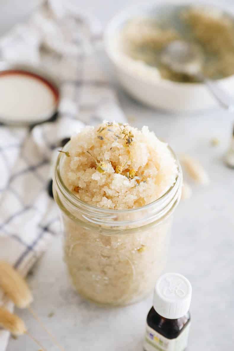 sugar scrub in a mason jar with essential oils.