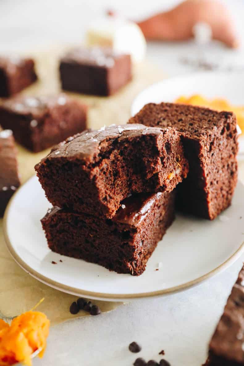 homemade sweet potato brownies on a white plate.