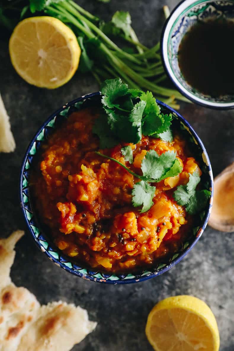 Root vegetable dal recipe in an Indian-style bowl with cilantro on top.