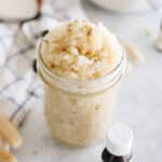 white sugar scrub recipe in a mason jar with instructions on how to make it.