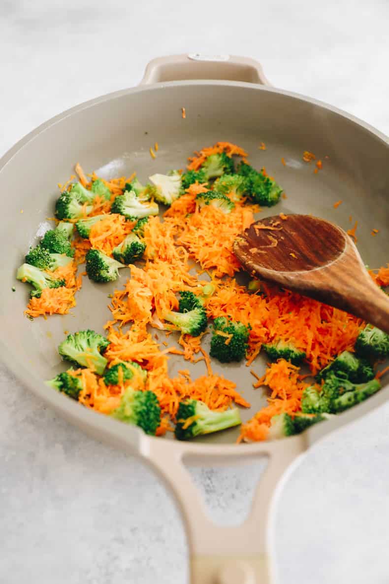 carrots and broccoli cooked in butter in a non-stick pan