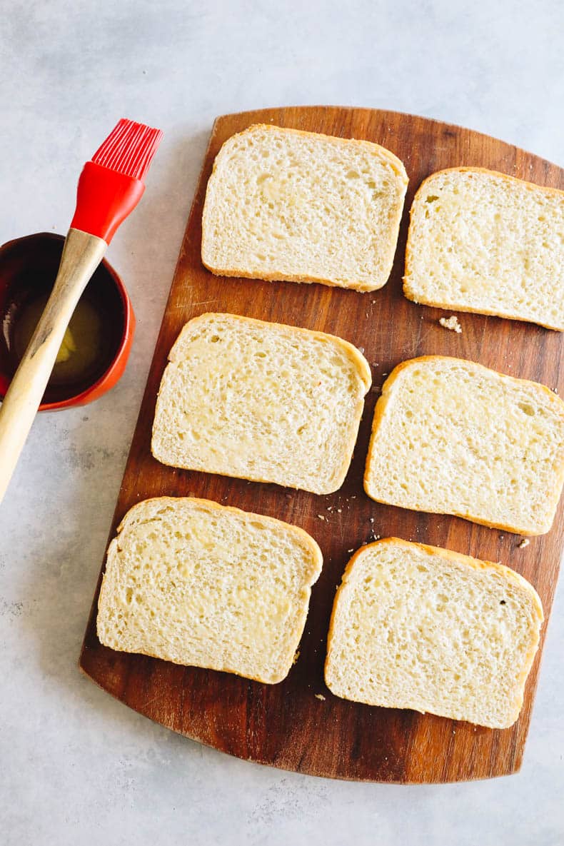 buttered bread on a cutting board