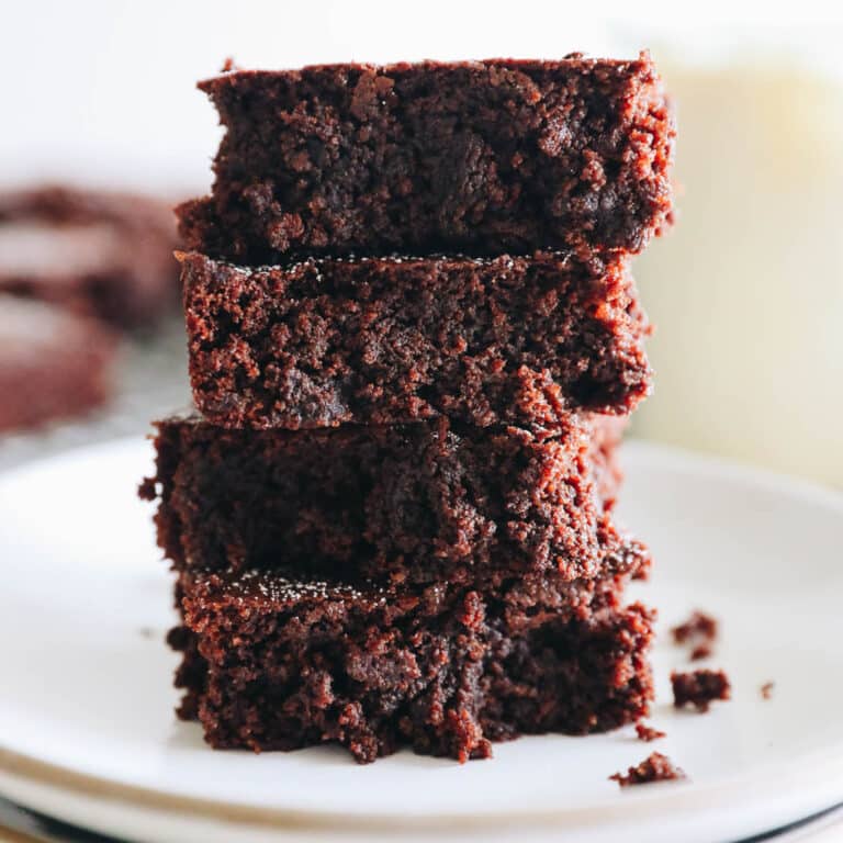 4 almond flour brownies stacked on top of each other.