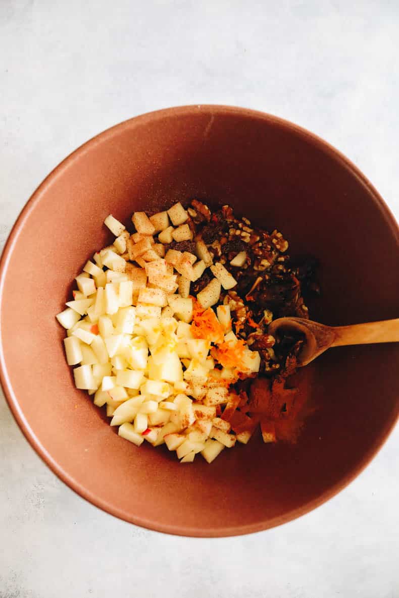 unmixed charoset in a large brown bowl.