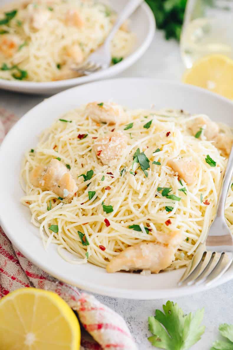 close-up of shallow white bowl with copycat olive garden chicken scampi