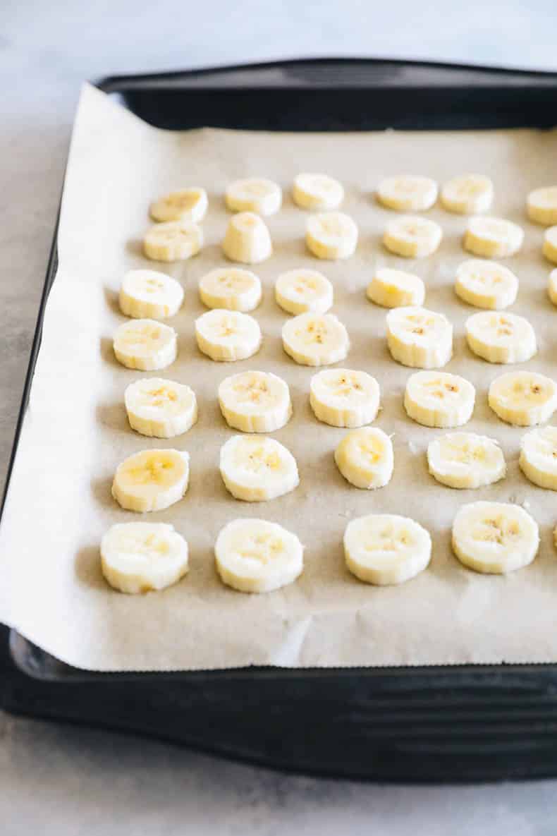 frozen banana coins in a baking sheet
