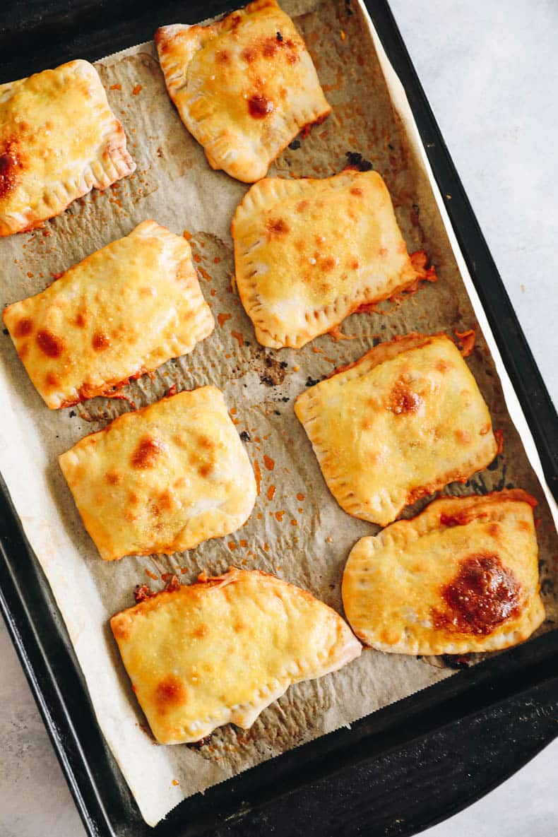 pizza pockets on a baking sheet right out of the oven.