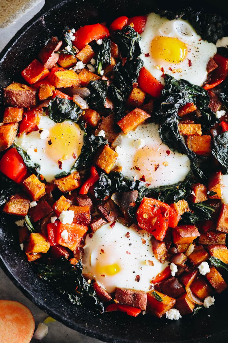 close up of sweet potato hash with baked eggs.